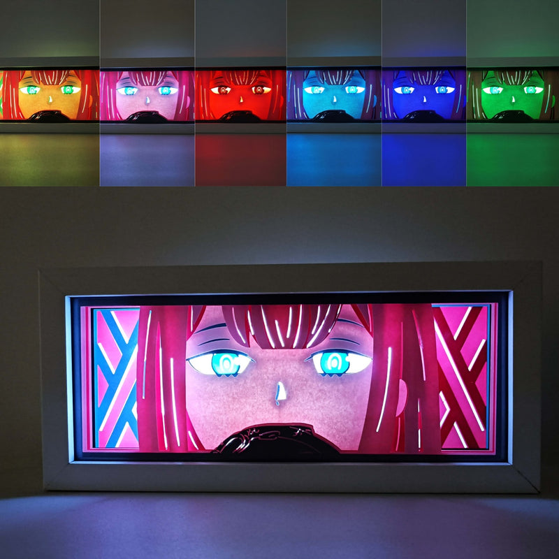 Custom Darling in the Franxx anime light box with 3D paper carving and RGB LED lights featuring Hiro and Zero Two. Perfect for anime gifts, Christmas decorations, and decor for fans and collectors. Remote-controlled colors create a futuristic ambiance for bedrooms, desks, or anime-themed spaces. This handmade piece is an ideal gift for holidays or birthdays, designed for lovers of emotional mecha action and eye-catching anime decor. A must-have for Darling in the Franxx fans to enhance their collection