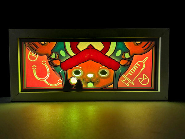 Custom One Piece light box with 3D paper carving and RGB LED lights featuring Tony Tony Chopper. Perfect for anime gifts, Christmas decor, and Chopper fans. Remote-controlled colors create a cute, heartwarming ambiance for any space. Ideal for holidays, birthdays, or special occasions, celebrating Chopper’s adorable charm, medical skills, and his journey with the Straw Hat Pirates. A must-have for One Piece fans.