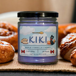 Handcrafted soy wax candle inspired by Kiki's Delivery Service from Studio Ghibli, featuring premium fragrances that capture the whimsical charm of the film. Made with 100% natural vegan wax and a lead-free Eco-wick, this eco-friendly candle brings to life the essence of beloved characters like Kiki, her loyal cat Jiji, and her friend Lily. Perfect for anime enthusiasts and collectors, it fills your space with a nostalgic and heartwarming scent reminiscent of the magic and adventure of Studio Ghibli.