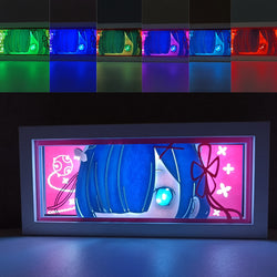 Custom Rezero light box with 3D paper carving and RGB LED lights featuring Subaru, Emilia, Rem, and Ram. Perfect for anime gifts, Christmas decor, and Rezero fans. Remote-controlled colors create a captivating, fantasy-themed ambiance for any space. Ideal for holidays, birthdays, or special occasions, celebrating Subaru’s time loops, Emilia’s magical powers, Rem’s fierce loyalty, and Ram’s sharp wit. A must-have for Rezero fans and collectors of isekai anime, dark fantasy, and unforgettable characters.