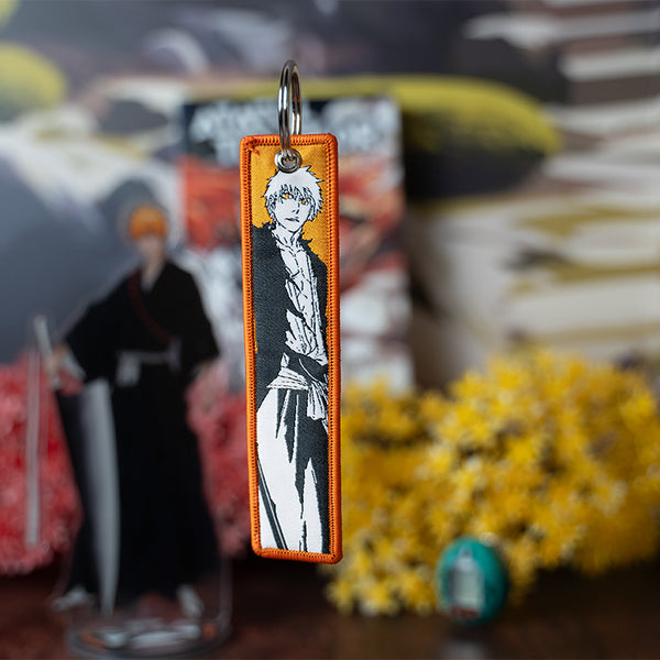 Striking Bleach Embroidered Jet Tag featuring high-quality stitching of Ichigo, Rukia, and Renji. Made from durable materials, this double-sided jet tag showcases bold, detailed embroidery that brings the intense battles and spirit world of Bleach to life. Perfect for keys, backpacks, or adding a touch of Soul Reaper style to your car. A must-have collectible and the perfect gift for Bleach fans and anime lovers who want to carry the power and essence of Ichigo and the Soul Society wherever they go!