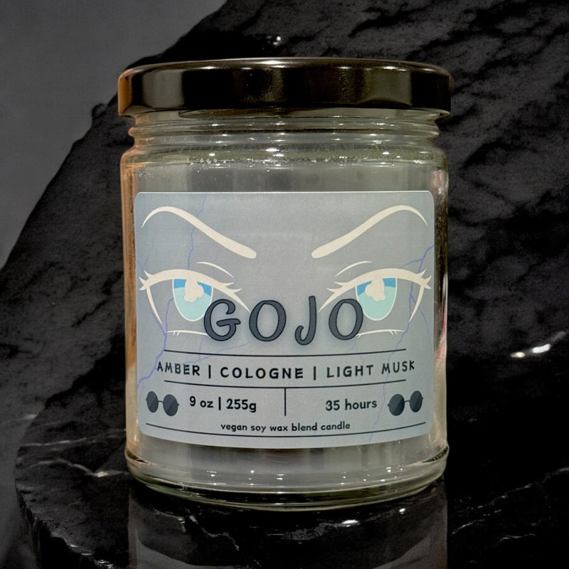 Handcrafted soy wax candle inspired by Jujutsu Kaisen, featuring premium fragrances of amber, cologne, and light musk. Made with 100% natural vegan wax and a lead-free Eco-wick, this candle offers an eco-friendly and long-lasting burn, perfect for fans of the hit anime series. Capturing the essence of the Jujutsu Kaisen world, this candle evokes the dynamic energy and spirit of beloved characters like Yuji Itadori, Megumi Fushiguro, Nobara Kugisaki, and Satoru Gojo. Ideal for collectors and anime enthusiast