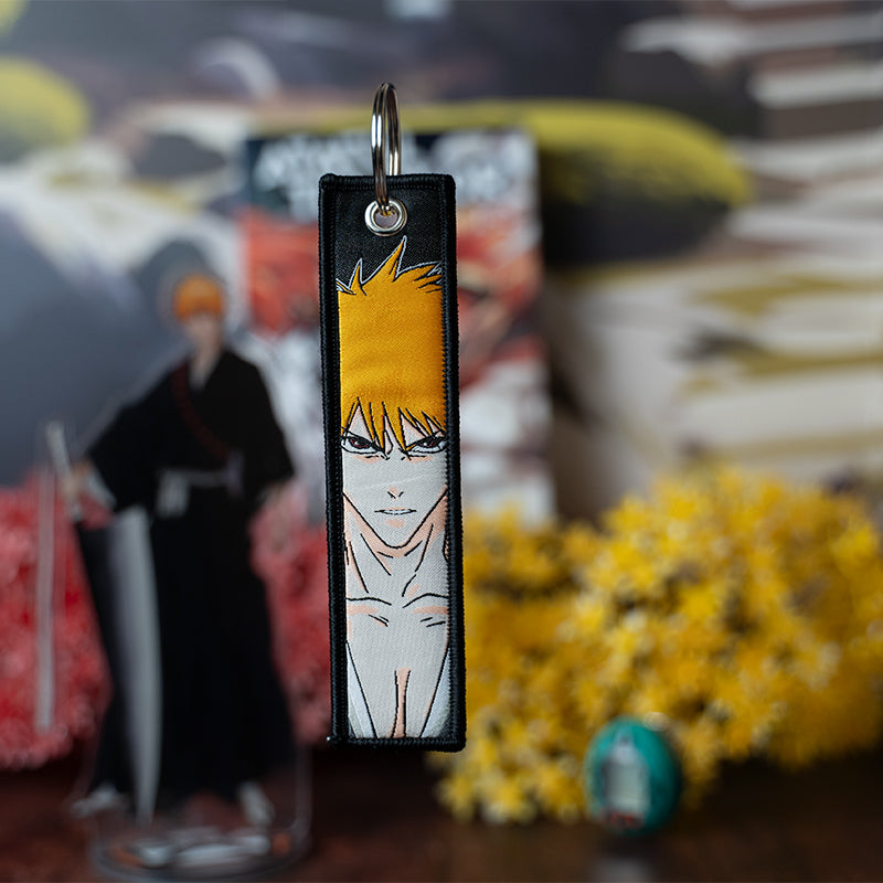 Striking Bleach Embroidered Jet Tag featuring high-quality stitching of Ichigo, Rukia, and Renji. Made from durable materials, this double-sided jet tag showcases bold, detailed embroidery that brings the intense battles and spirit world of Bleach to life. Perfect for keys, backpacks, or adding a touch of Soul Reaper style to your car. A must-have collectible and the perfect gift for Bleach fans and anime lovers who want to carry the power and essence of Ichigo and the Soul Society wherever they go!