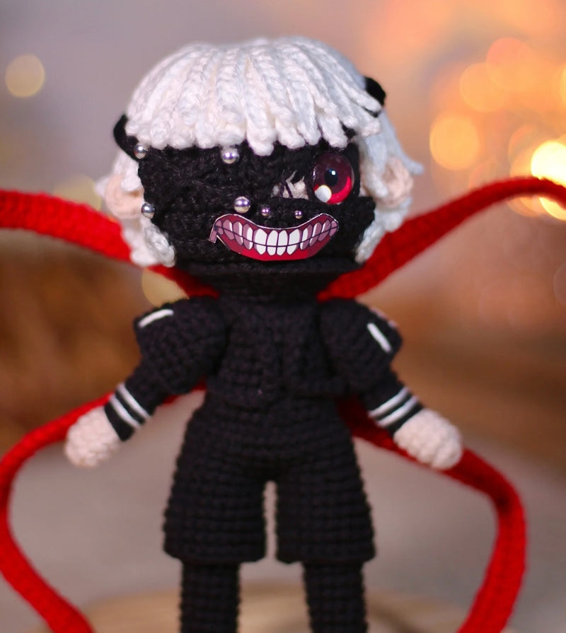 Handmade Tokyo Ghoul Ken Kaneki crochet doll, featuring intricate details inspired by the iconic anime character. This 10–12 inch (25–30 cm) doll showcases Ken's signature black outfit, white hair, and mask, making it a perfect collectible or gift for Tokyo Ghoul fans. Ideal for birthdays, holidays, or as a unique addition to any anime merchandise collection. Crafted with high-quality yarn, this doll is both durable and adorable, a must-have for anime enthusiasts and collectors.