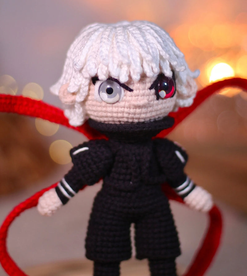 Handmade Tokyo Ghoul Ken Kaneki crochet doll, featuring intricate details inspired by the iconic anime character. This 10–12 inch (25–30 cm) doll showcases Ken's signature black outfit, white hair, and mask, making it a perfect collectible or gift for Tokyo Ghoul fans. Ideal for birthdays, holidays, or as a unique addition to any anime merchandise collection. Crafted with high-quality yarn, this doll is both durable and adorable, a must-have for anime enthusiasts and collectors.