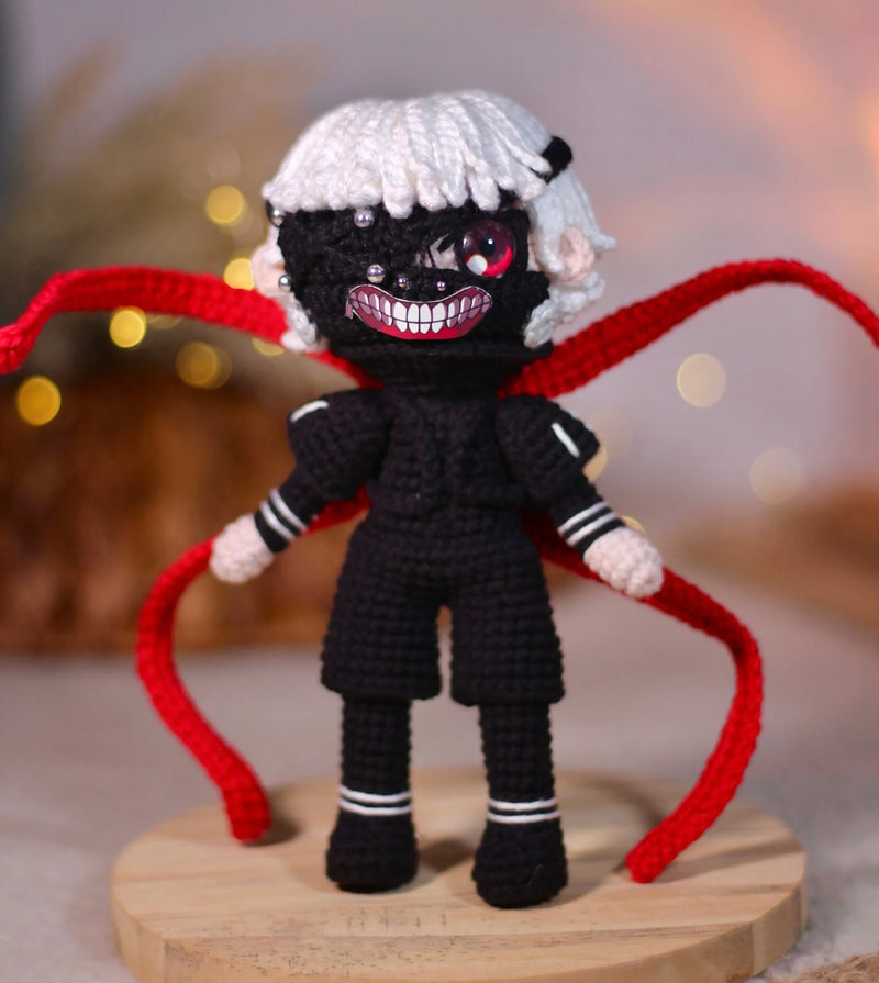 Handmade Tokyo Ghoul Ken Kaneki crochet doll, featuring intricate details inspired by the iconic anime character. This 10–12 inch (25–30 cm) doll showcases Ken's signature black outfit, white hair, and mask, making it a perfect collectible or gift for Tokyo Ghoul fans. Ideal for birthdays, holidays, or as a unique addition to any anime merchandise collection. Crafted with high-quality yarn, this doll is both durable and adorable, a must-have for anime enthusiasts and collectors.