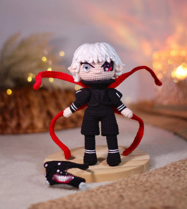 Handmade Tokyo Ghoul Ken Kaneki crochet doll, featuring intricate details inspired by the iconic anime character. This 10–12 inch (25–30 cm) doll showcases Ken's signature black outfit, white hair, and mask, making it a perfect collectible or gift for Tokyo Ghoul fans. Ideal for birthdays, holidays, or as a unique addition to any anime merchandise collection. Crafted with high-quality yarn, this doll is both durable and adorable, a must-have for anime enthusiasts and collectors.