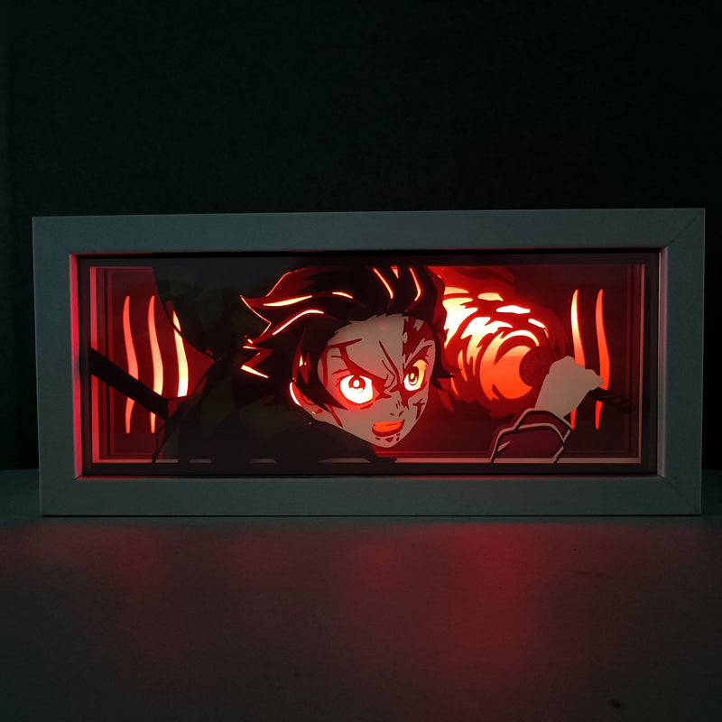 Custom Demon Slayer anime light box with 3D paper carving and RGB LED lights featuring Tanjiro and Nezuko. Perfect for anime gifts, Christmas decorations, and decor for fans and collectors. Remote-controlled colors create a vibrant, action-packed ambiance for bedrooms, desks, or anime-themed spaces. This handmade piece is an ideal gift for holidays or birthdays, designed for lovers of intense battles and stunning anime decor. A must-have for Demon Slayer fans looking to enhance their collection.