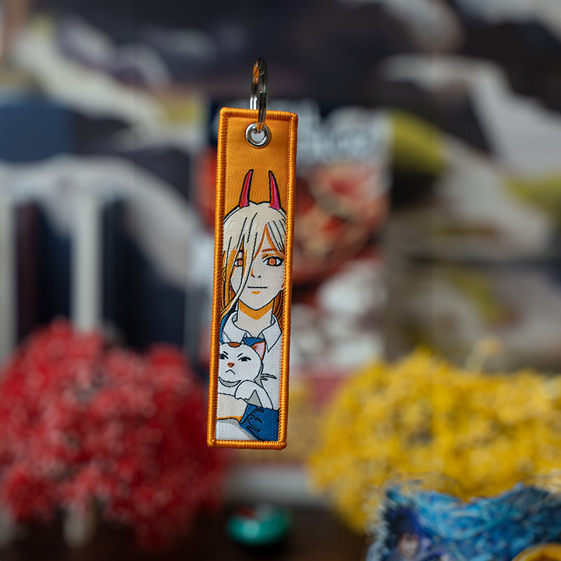 Bold Chainsaw Man Embroidered Jet Tag featuring high-quality stitching of Denji, Power, and Aki. Made from durable materials, this double-sided jet tag captures the thrilling chaos and dark humor of the series. Perfect for keys, backpacks, or adding a fierce touch to your car, it’s a must-have collectible for Chainsaw Man fans and anime enthusiasts looking to carry the devil-hunting spirit with them everywhere!