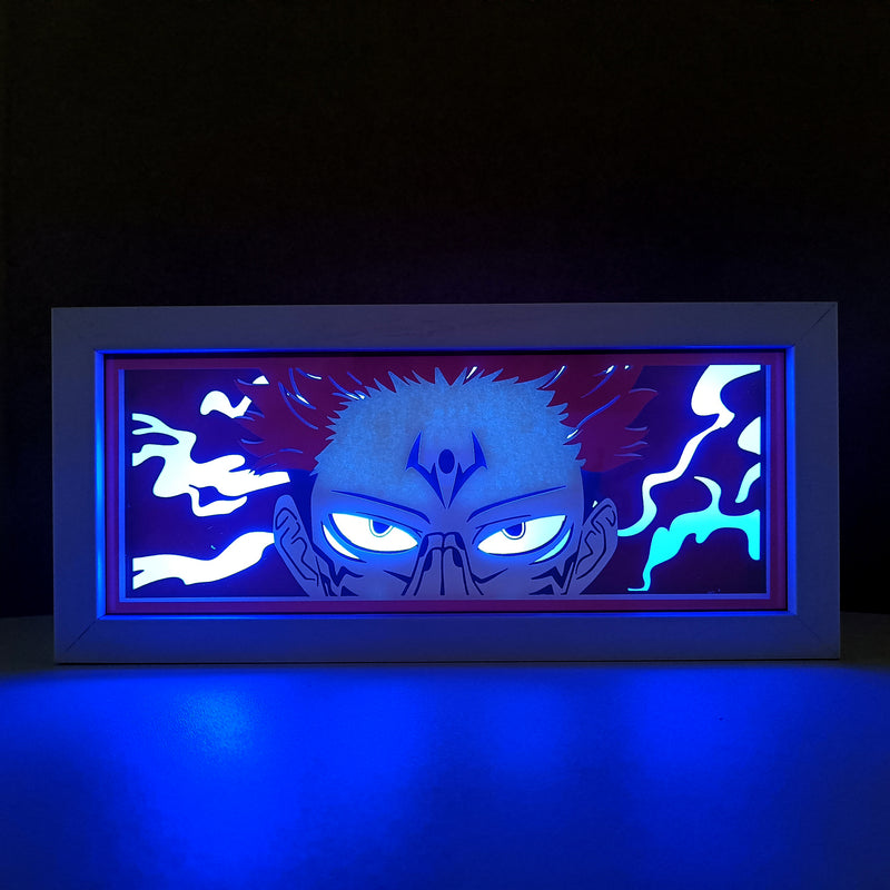 Jujutsu Kaisen anime light box with 3D paper carving and LED RGB lighting, featuring Yuji Itadori, Gojo Satoru, and Sukuna. This custom handmade light box brings the intense sorcery battles to life with remote-controlled color options, perfect for adding a supernatural vibe to any bedroom, desk, or anime-inspired space