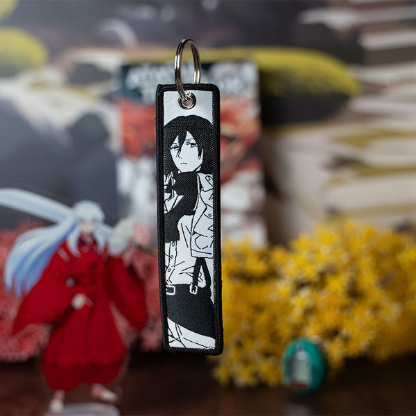 Epic Attack on Titan acrylic keychain featuring double-sided designs of Eren, Mikasa, Armin, Levi, and Sasha. Bold, vibrant, scratch-resistant colors with a glitter epoxy coating make this keychain truly eye-catching. Perfect for accessorizing backpacks, lanyards, and Ita bags, with a durable silver D-clasp for lasting quality. A must-have collectible and the ultimate gift for Attack on Titan fans and anime lovers!