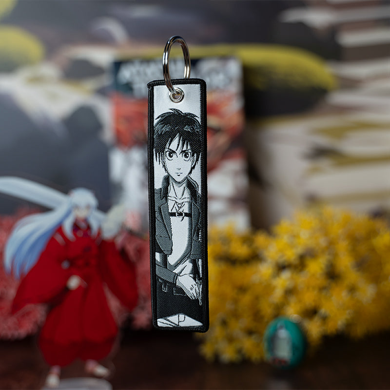 Epic Attack on Titan acrylic keychain featuring double-sided designs of Eren, Mikasa, Armin, Levi, and Sasha. Bold, vibrant, scratch-resistant colors with a glitter epoxy coating make this keychain truly eye-catching. Perfect for accessorizing backpacks, lanyards, and Ita bags, with a durable silver D-clasp for lasting quality. A must-have collectible and the ultimate gift for Attack on Titan fans and anime lovers!