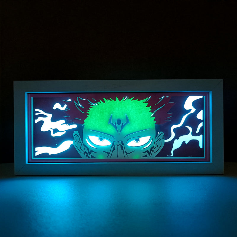 Jujutsu Kaisen anime light box with 3D paper carving and LED RGB lighting, featuring Yuji Itadori, Gojo Satoru, and Sukuna. This custom handmade light box brings the intense sorcery battles to life with remote-controlled color options, perfect for adding a supernatural vibe to any bedroom, desk, or anime-inspired space