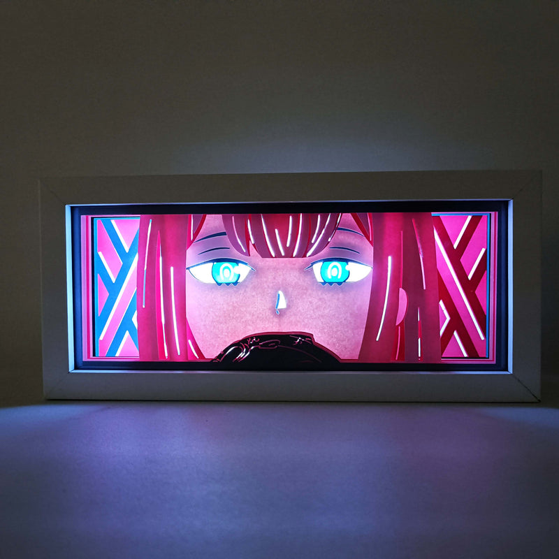 Custom Darling in the Franxx anime light box with 3D paper carving and RGB LED lights featuring Hiro and Zero Two. Perfect for anime gifts, Christmas decorations, and decor for fans and collectors. Remote-controlled colors create a futuristic ambiance for bedrooms, desks, or anime-themed spaces. This handmade piece is an ideal gift for holidays or birthdays, designed for lovers of emotional mecha action and eye-catching anime decor. A must-have for Darling in the Franxx fans to enhance their collection