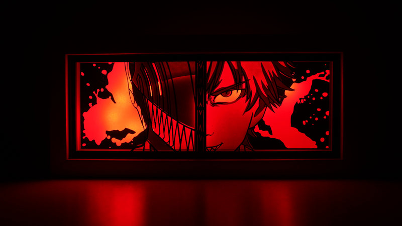 hainsaw Man anime light box with 3D paper carving and LED RGB lights, featuring Denji and Pochita. This custom handmade light box brings the intense action of Chainsaw Man to life with remote-controlled colors. Perfect for adding a gritty, rebellious touch to your bedroom, desk, or anime-themed decor