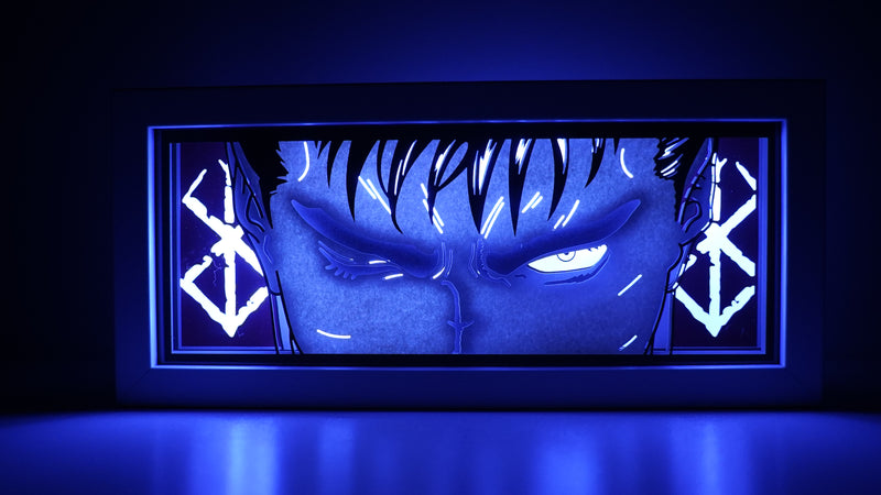 Berserk anime light box featuring Guts in dark, powerful 3D paper carving with LED RGB lights. Handcrafted for fans of this dark fantasy, the light box offers remote color control and flickering tealight effects, perfect for adding a brooding, gothic touch to your bedroom, desk, or home decor