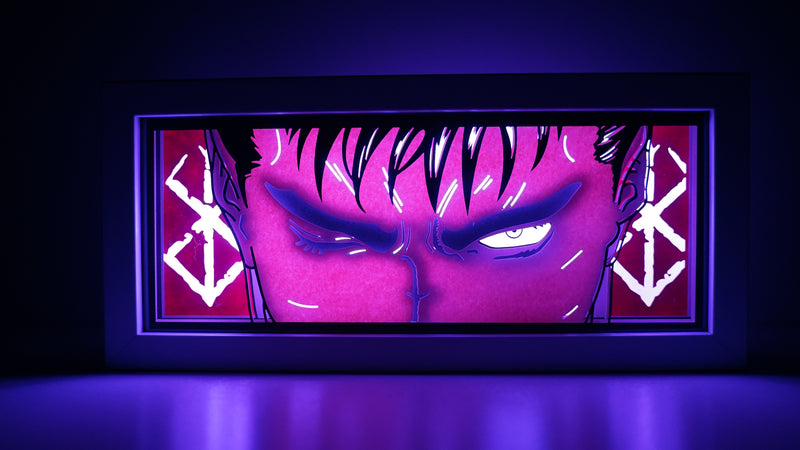 Berserk anime light box featuring Guts in dark, powerful 3D paper carving with LED RGB lights. Handcrafted for fans of this dark fantasy, the light box offers remote color control and flickering tealight effects, perfect for adding a brooding, gothic touch to your bedroom, desk, or home decor