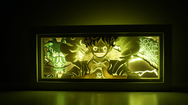 Custom One Piece light box with 3D paper carving and RGB LED lights featuring Luffy in Gear 5 form. Perfect for anime gifts, Christmas decor, and Luffy fans. Remote-controlled colors create an epic, electrifying ambiance for any space. Ideal for holidays, birthdays, or special occasions, celebrating Luffy’s ultimate transformation, wild power, and his quest to become the Pirate King. A must-have for One Piece fans looking to showcase Luffy’s most powerful form.