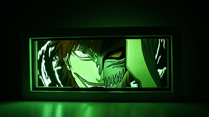 Bleach anime light box with custom 3D paper carving and LED RGB lighting. Featuring Ichigo Kurosaki in his Soul Reaper form, this handmade light box offers remote-controlled colors and is perfect for adding a dynamic, spiritual vibe to your home decor. Ideal for Bleach fans and anime lovers