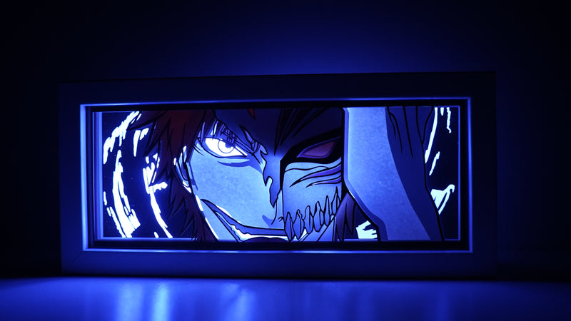 Bleach anime light box with custom 3D paper carving and LED RGB lighting. Featuring Ichigo Kurosaki in his Soul Reaper form, this handmade light box offers remote-controlled colors and is perfect for adding a dynamic, spiritual vibe to your home decor. Ideal for Bleach fans and anime lovers