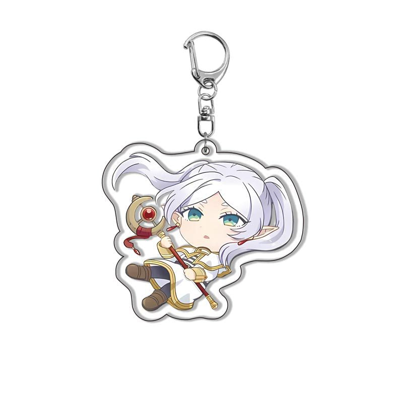 Close-up of Frieren Beyond Journey’s End acrylic keychain showing Frieren, Himmel, Fern and Stark anime character design
