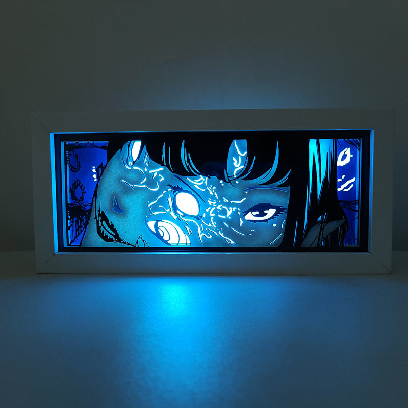 Custom Junji Ito light box with 3D paper carving and RGB LED lights featuring iconic imagery from Uzumaki and Tomie. Perfect for horror fans, anime gifts, and creepy decor. Remote-controlled colors create an eerie ambiance for any space. Ideal for holidays, birthdays, or Halloween, celebrating Junji Ito’s psychological horror and haunting visuals. A must-have for Japanese horror manga fans and collectors.