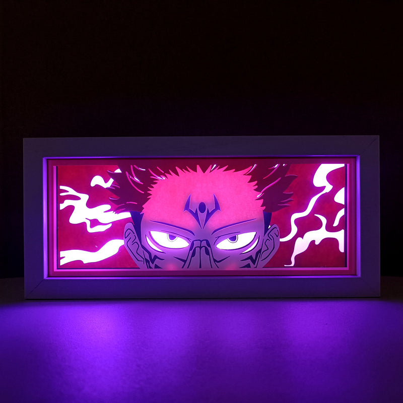 Jujutsu Kaisen anime light box with 3D paper carving and LED RGB lighting, featuring Yuji Itadori, Gojo Satoru, and Sukuna. This custom handmade light box brings the intense sorcery battles to life with remote-controlled color options, perfect for adding a supernatural vibe to any bedroom, desk, or anime-inspired space