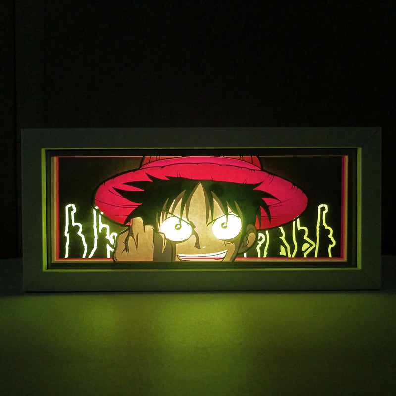 Custom One Piece light box with 3D paper carving and RGB LED lights featuring Monkey D. Luffy. Perfect for anime gifts, Christmas decor, and Luffy fans. Remote-controlled colors create a vibrant, adventurous ambiance for any space. Ideal for holidays, birthdays, or special occasions, celebrating Luffy’s boundless spirit, epic battles, and quest to become the Pirate King. A must-have for One Piece fans.