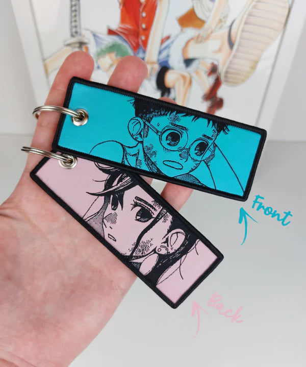 Dandadan embroidered jet tag keychain, Okarun key tag, Momo Ayase anime keychain, Yukinobu Tatsu manga accessory, Japanese anime key tag, otaku embroidered keychain, anime merch gift, Harajuku streetwear accessory, Tokyo street fashion keychain, aesthetic anime jet tag, cosplay bag charm, anime convention accessory, manga collector gift, JDM style embroidered tag, luggage tag, keyring for anime fans, Dandadan cosplay prop.