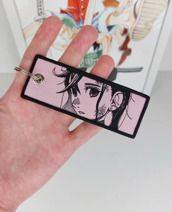 Dandadan embroidered jet tag keychain, Okarun key tag, Momo Ayase anime keychain, Yukinobu Tatsu manga accessory, Japanese anime key tag, otaku embroidered keychain, anime merch gift, Harajuku streetwear accessory, Tokyo street fashion keychain, aesthetic anime jet tag, cosplay bag charm, anime convention accessory, manga collector gift, JDM style embroidered tag, luggage tag, keyring for anime fans, Dandadan cosplay prop.