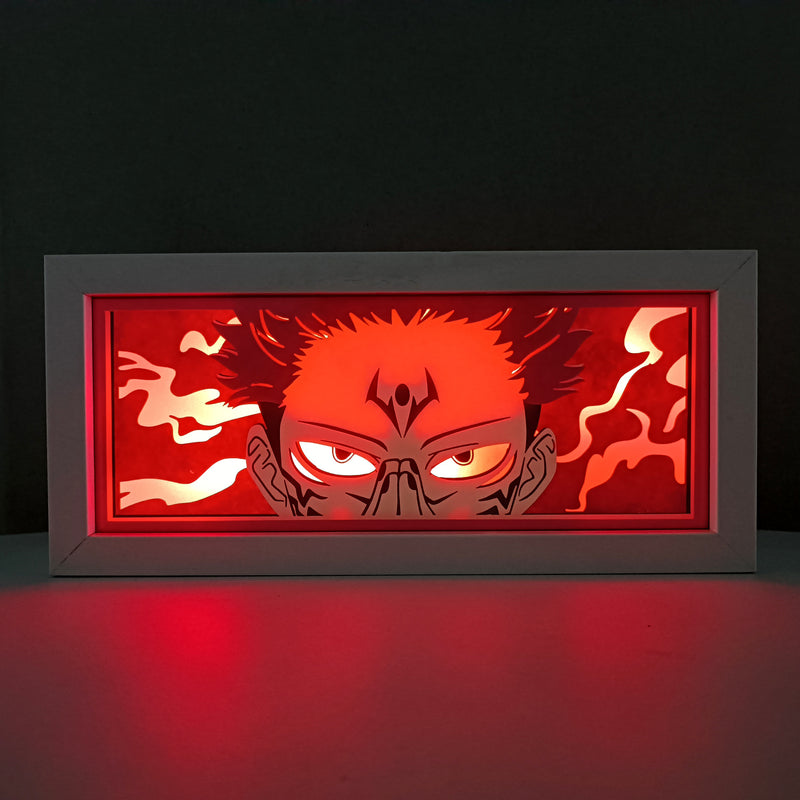 Jujutsu Kaisen anime light box with 3D paper carving and LED RGB lighting, featuring Yuji Itadori, Gojo Satoru, and Sukuna. This custom handmade light box brings the intense sorcery battles to life with remote-controlled color options, perfect for adding a supernatural vibe to any bedroom, desk, or anime-inspired space