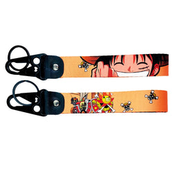 Adventurous One Piece JDM Lanyard Keychain featuring vibrant designs of Luffy, Zoro, Nami, Sanji, and the Straw Hat Pirates Jolly Roger. Made from durable, high-quality fabric with eye-catching, double-sided prints, perfect for keeping keys, ID badges, or adding flair to your backpack. Infusing the thrill of One Piece adventures with JDM style, this lanyard is a must-have for anime and car culture fans ready to sail the Grand Line and show off their passion.