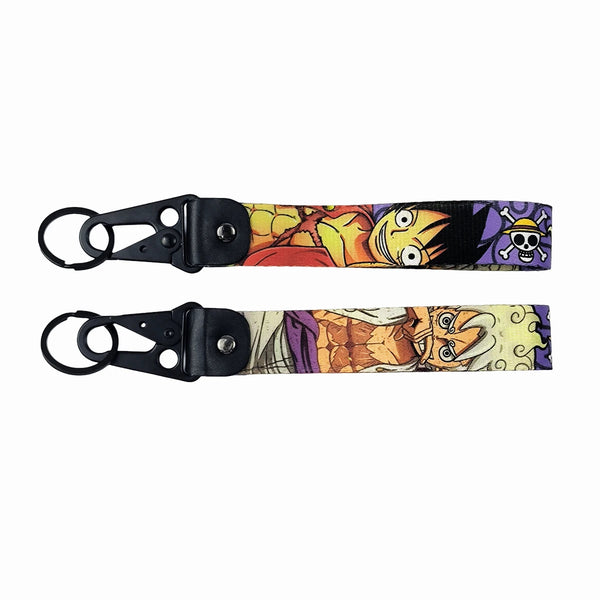 Adventurous One Piece JDM Lanyard Keychain featuring vibrant designs of Luffy, Zoro, Nami, Sanji, and the Straw Hat Pirates Jolly Roger. Made from durable, high-quality fabric with eye-catching, double-sided prints, perfect for keeping keys, ID badges, or adding flair to your backpack. Infusing the thrill of One Piece adventures with JDM style, this lanyard is a must-have for anime and car culture fans ready to sail the Grand Line and show off their passion.