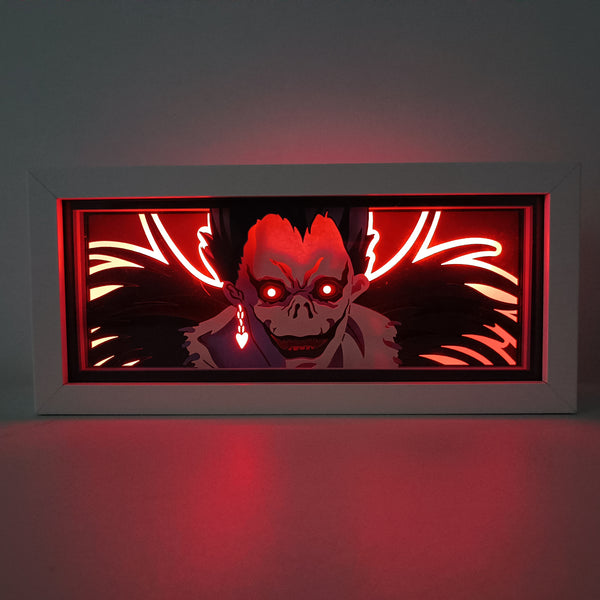 Custom Death Note anime light box with 3D paper carving and RGB LED lights featuring Light Yagami and Ryuk. Perfect for anime gifts, Christmas decorations, and decor for fans and collectors. Remote-controlled colors create a dark, mysterious ambiance for bedrooms, desks, or anime-themed spaces. This handmade piece is an ideal gift for holidays or birthdays, designed for lovers of psychological thrillers and iconic anime decor. A must-have for Death Note fans looking to enhance their collection.