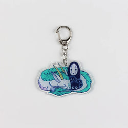 Studio Ghibli Spirited Away Acrylic Keychain – Featuring beloved characters like Chihiro and Haku in chibi style. High-quality acrylic design perfect for Studio Ghibli and Spirited Away fans. Lightweight, durable keychain ideal for keys, bags, or backpacks. Unique accessory for anime collectors and lovers of whimsical, iconic movie art. Perfect gift for fans of Spirited Away and Studio Ghibli memorabilia.