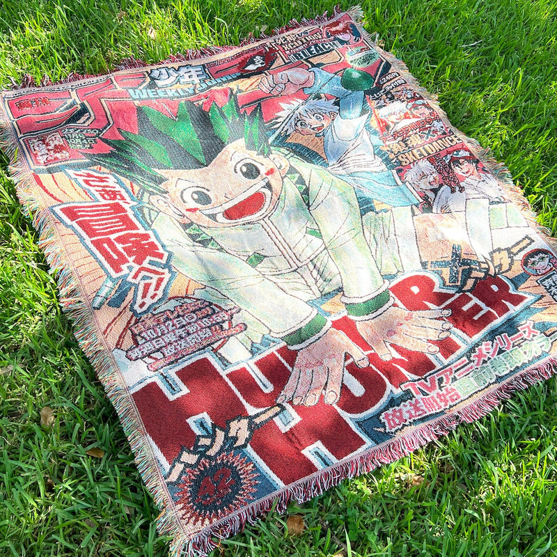 Hunter x Hunter Woven Tapestry Blanket featuring iconic characters like Gon, Killua, and Hisoka, brought to life with stunning detail and vibrant colors. This high-quality tapestry captures the adventurous spirit and emotional depth of the series, making it perfect for home decor, a cozy throw, or a unique gift for Hunter x Hunter fans. Celebrate the unforgettable journey through the world of Hunters with this beautifully crafted piece that showcases your love for one of anime’s most beloved series