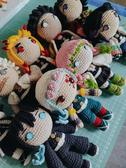 Handmade Demon Slayer crochet dolls featuring your favorite characters like Tanjiro Kamado, Nezuko Kamado, Zenitsu Agatsuma, and Inosuke Hashibira. Perfect anime-inspired gifts for fans and collectors, these intricately detailed dolls make an ideal present for birthdays, holidays, or any special occasion. Crafted with care, these 10–12 inch (25–30 cm) soft plush dolls are perfect for display, cuddling, or adding to your anime merchandise collection. A must-have for Demon Slayer enthusiasts.