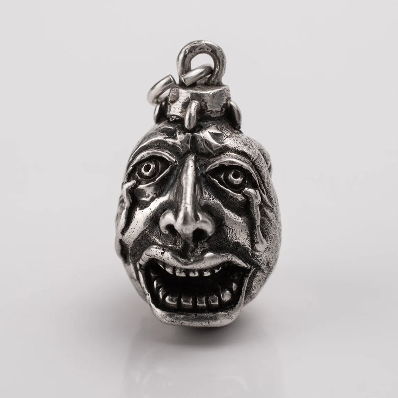 Handcrafted Behelit Jewelry – Berserk-inspired pendant necklace featuring Guts, Griffith, and God Hand symbolism with double-sided design: awakened face and sleeping face. High-quality pewter, hand-cast, unique imperfections, 22-inch (55.9 cm) stainless steel ball chain, secure lobster claw closure. Perfect for Berserk fans, anime collectors, dark fantasy lovers, cosplay, and unique gifts. Symbolic, collectible, artisan design.