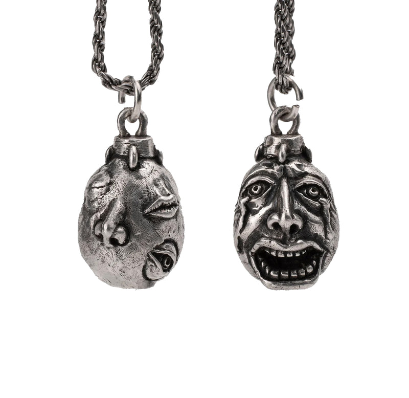 Handcrafted Behelit Jewelry – Berserk-inspired pendant necklace featuring Guts, Griffith, and God Hand symbolism with double-sided design: awakened face and sleeping face. High-quality pewter, hand-cast, unique imperfections, 22-inch (55.9 cm) stainless steel ball chain, secure lobster claw closure. Perfect for Berserk fans, anime collectors, dark fantasy lovers, cosplay, and unique gifts. Symbolic, collectible, artisan design.