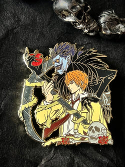 Death Note Enamel Pin Collection – Limited Edition Collectibles Featuring Characters from Death Note, such as Light Yagami, L, Ryuk, and Misa Amane. Premium Black Nickel Finish, Hard Enamel with Print Details, Numbered with Lasered Logo, Large 3 Inches (7.6 cm), Double Butterfly Clutch for Secure Attachment. Perfect Anime Merchandise for Death Note Fans, Collectors, and Enthusiasts. Includes Exclusive Character Designs, Anime Accessories, Otaku Gifts, Anime Convention Collectibles, and Cosplay Accessories.