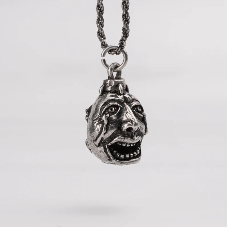 Handcrafted Behelit Jewelry – Berserk-inspired pendant necklace featuring Guts, Griffith, and God Hand symbolism with double-sided design: awakened face and sleeping face. High-quality pewter, hand-cast, unique imperfections, 22-inch (55.9 cm) stainless steel ball chain, secure lobster claw closure. Perfect for Berserk fans, anime collectors, dark fantasy lovers, cosplay, and unique gifts. Symbolic, collectible, artisan design.