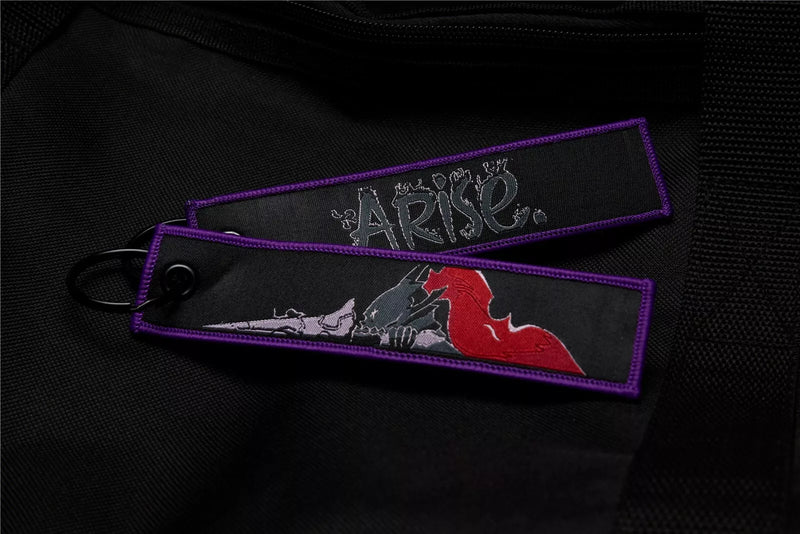 Solo Leveling: Ore dake Level Up na Ken Embroidered Jet Tag featuring Cha Hae-In, the Shadow Monarch symbol, and his iconic dual daggers. Crafted from durable, high-quality materials with bold, double-sided embroidery, this jet tag perfectly captures the intense action and dark fantasy of Solo Leveling. Perfect for keys, backpacks, or cars, this collectible is a must-have for fans of Sung Jin-Woo’s journey and anime enthusiasts who love epic leveling-up stories. Show off your love for Solo Leveling