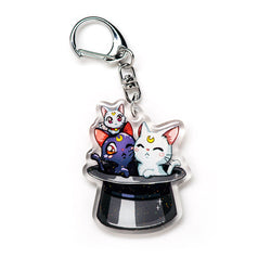 Charming Sailor Moon acrylic keychain with double-sided designs of Sailor Moon, Luna, and Tuxedo Mask. Featuring vibrant, scratch-resistant colors and a glitter epoxy coating. Perfect for accessorizing backpacks, lanyards, and Ita bags. Durable silver D-clasp ensures long-lasting quality. A magical collectible and the ideal gift for Sailor Moon fans and anime lovers!