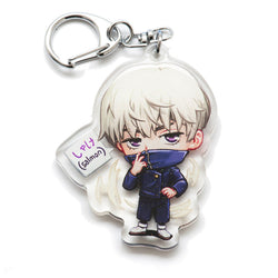 Must-have Jujutsu Kaisen acrylic keychain with double-sided designs of Yuji, Gojo, and Nobara. Vibrant, scratch-resistant colors and glitter epoxy coating make it stand out. Perfect for backpacks, lanyards, and Ita bags. Durable silver D-clasp ensures long-lasting quality. A limited edition collectible and the perfect gift for anime fans and collectors