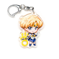 Charming Sailor Moon acrylic keychain with double-sided designs of Sailor Moon, Luna, and Tuxedo Mask. Featuring vibrant, scratch-resistant colors and a glitter epoxy coating. Perfect for accessorizing backpacks, lanyards, and Ita bags. Durable silver D-clasp ensures long-lasting quality. A magical collectible and the ideal gift for Sailor Moon fans and anime lovers!